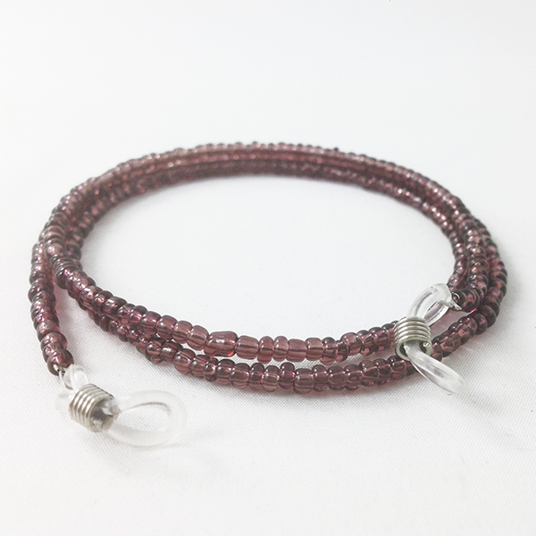 Glasses cord with purple pearls.